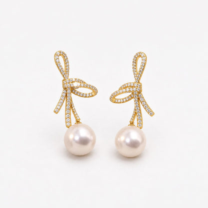 Pearl Earrings with Shiny Bow in Gold